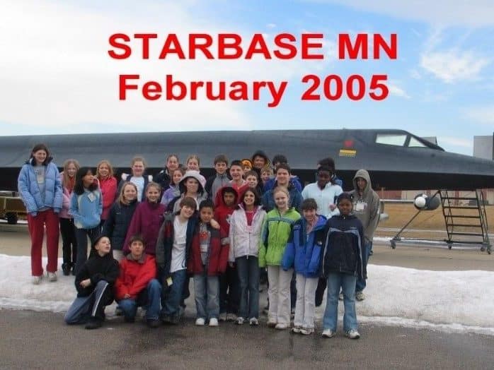 Students in front of a plane. 